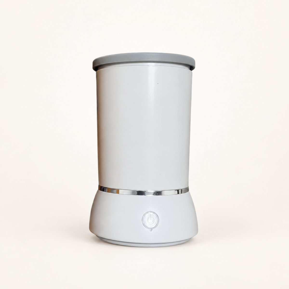 White automatic paw cleaner with grey rim, silver band and front power button on a neutral background